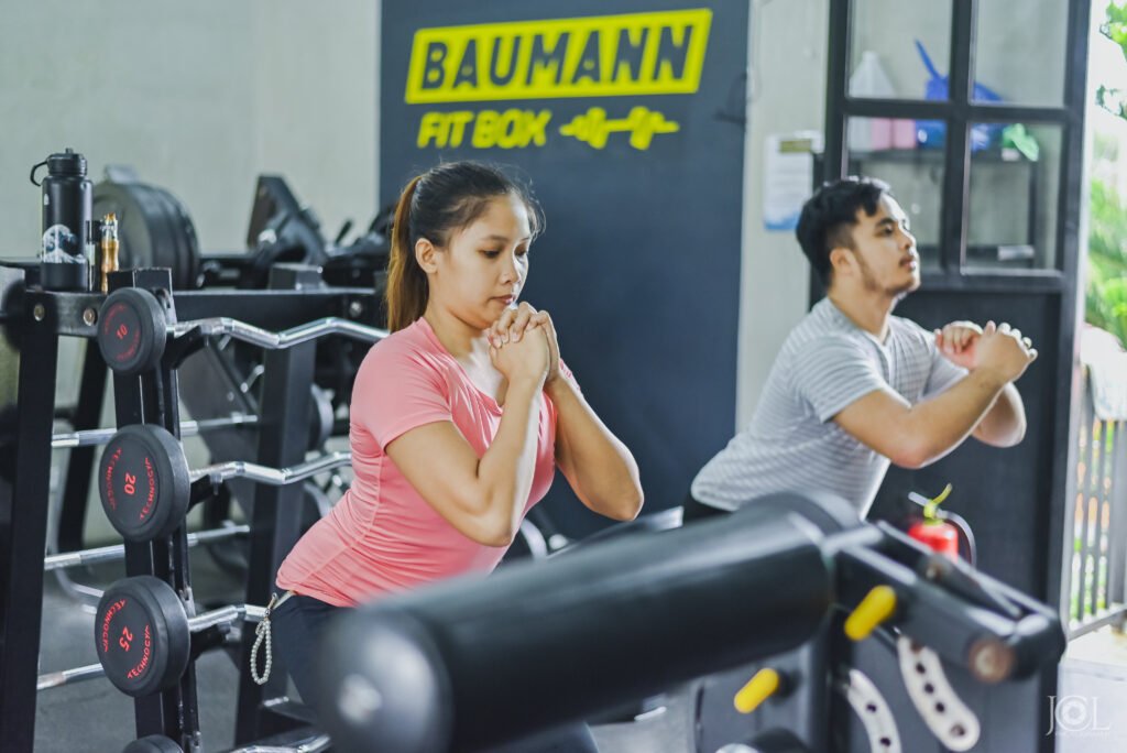 People doing warm up and cool down in the gym