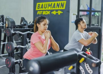 People doing warm up and cool down in the gym
