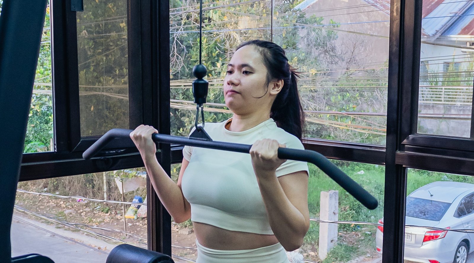 woman using a gym equipment